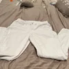Venus white Jean size 14 has a small stain in right side of pants