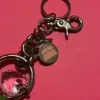 NWOT KATHY Van Zeeland Silver Tone Metal With Glass Stone Bag Charm/Key Ring - Image 3